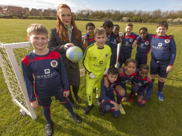 B&amp;DWC -8665 - Lucy from Barratt Homes with the team in their brand new kits