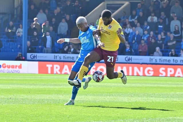 Malik Mothersille in action for Posh v Cobblers. Photo David Lowndes.