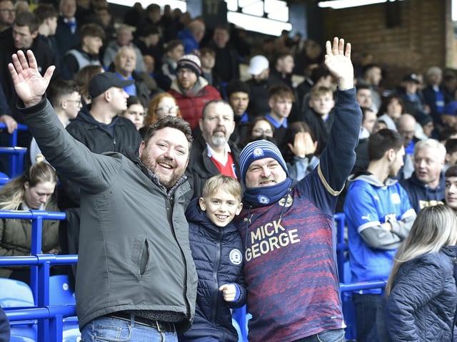 Peterborough United fans watch as their side slip to defeat against Blackpool.