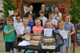 Pupils from Hampton College Primary school helping out at Mulberry Tree Farm pub, in Hampton, to raise funds for a school trip to the theatre