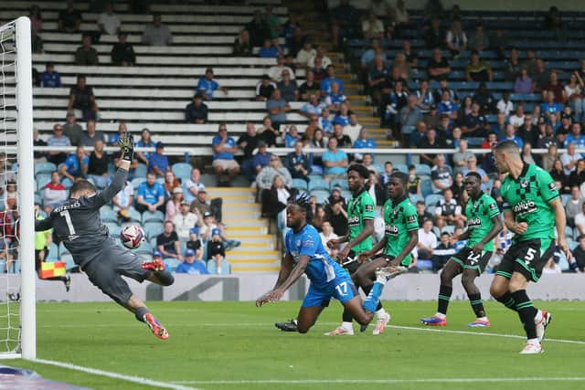 Ricky-Jade Jones of Peterborough United has a header saved by Josh Griffiths of Bristol Rovers. (Photo by Joe Dent/Will T Photography/Bristol Rovers)