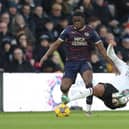 Posh star Kwame Poku in a battle with Nathaniel Mendez-Laing of Derby. Photo Joe Dent/theposh.com.
