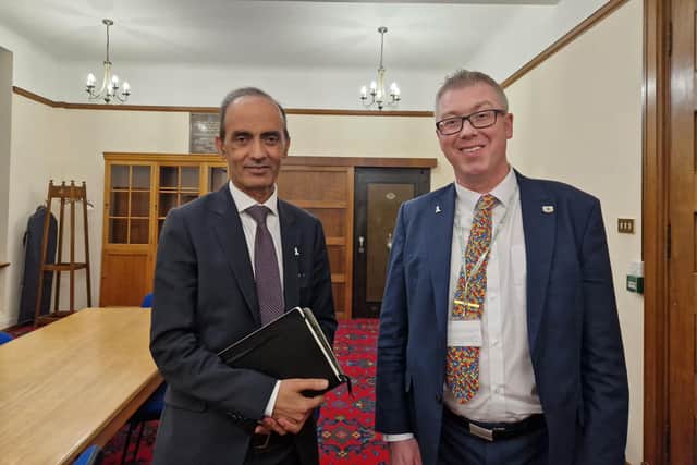 Cllrs Mohammed Farooq and John Howard after Peterborough budget vote