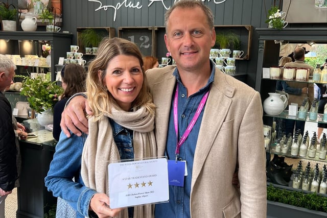 Designer Sophie Allport with Jem Allport on the four star wiunning stand at the Chelsea Flower Show in 2022
