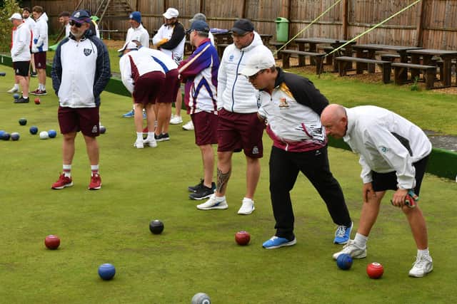 The bowlers of Hunts and Northants studying an end in the MIddleton Cup match at Parkway. Photo David Lowndes.