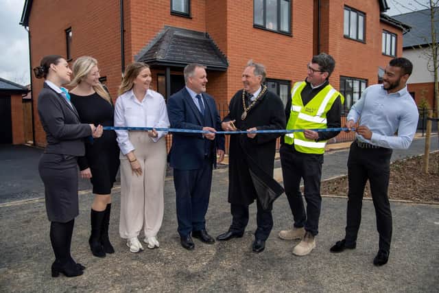 Left to right, Hollie Courten Sales Consultant, Hannah Dorner Sales Manager, Megan Doherty Account Manager from Edward Thomas Interiors, Fraser Hopes Managing Director, Councillor Alan Dowson Mayor of Peterborough, Wesley Egan Assistant Site Manager, and Joel Tedham Sales Manager opening one of the new show homes at Hampton Water.