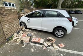 The car crashed into the wall if Car Haven on Bishop's Road.