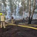 Fire fighters battling the blaze at Holme Fen