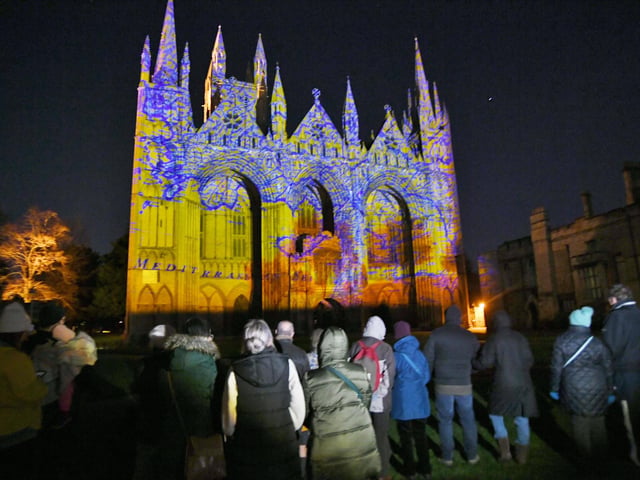Crowds watch The Beginning Luxmuralis light and sound show at Peterborough Cathedral