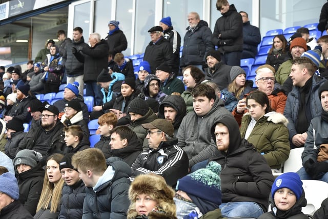 Peterborough United fans watch the 2-1 FA Cup win over Doncaster Rovers.
