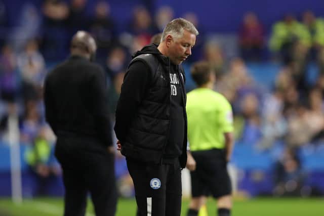 Peterborough United Manager Darren Ferguson cuts a dejected figure on the touchline. Photo: Joe Dent.