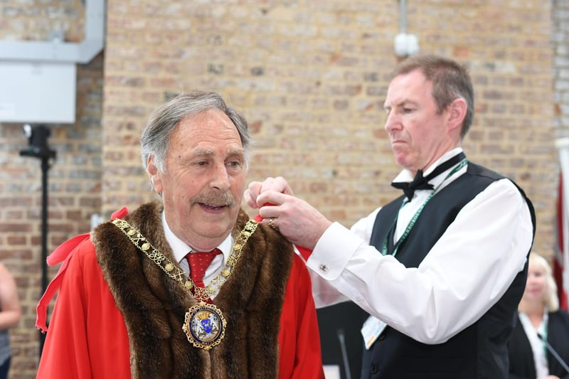 Councillor Alan Dowson was elected Mayor of Peterborough on 23 May, 2022.  He stated that he intended to be "visible and as active as possible" in the role so that "the people of Peterborough know who their Mayor is." Reflecting on his first year as First Citizen, Dr Dowson described the past seven months as "a great experience," adding: "It has been so worthwhile." Here we see him being fitted for his official garb.