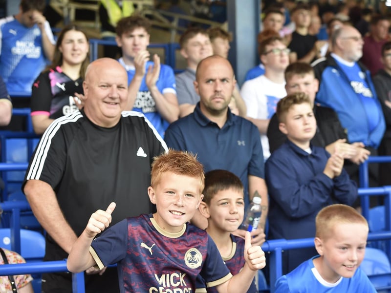 Peterborough United fans watch the draw with Leyton Orient.