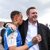 Darragh MacAnthony celebrates promotion from League One with Jonson Clarke-Harris in May, 2021. Photo: Joe Dent.