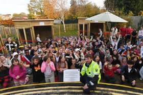 Old Fletton primary school year 5 and 6 pupils with sponsor  Ryan Reveley (assistant construction manager with ISG) at the opening of the new outdoor play area 