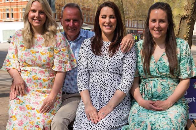 The reunion photo of Dr Richard Scott and his three daughters.