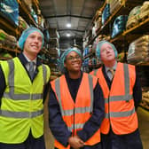 Secretary of State for Business and Trade Kemi Badenoch visiting the Masteroast coffee company at Fengate with commercial director Matthew Mills, left, and Peterborough MP Paul Bristow, right.