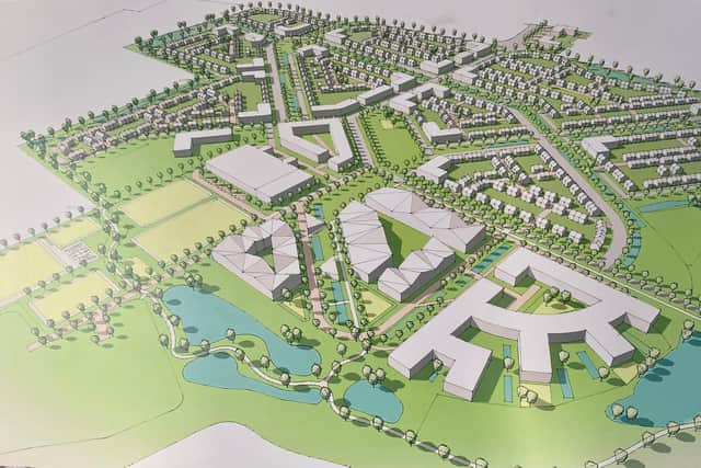 This image shows the location of the planned leisure village (front) at the East of England Showground with housing towards to back.