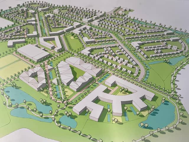This image shows the location of the planned leisure village (front) at the East of England Showground with housing towards to back.