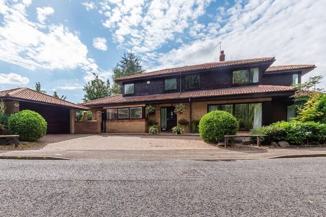 The property is described as offering a "unique build style" and "versatile living"