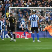 Michael Smith of Sheffield Wednesday scores the opening goal from the penalty spot past Will Norris of Peterborough United. Photo: Joe Dent/theposh.com.