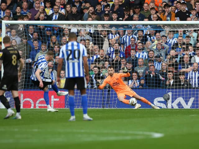 Michael Smith of Sheffield Wednesday scores the opening goal from the penalty spot past Will Norris of Peterborough United. Photo: Joe Dent/theposh.com.