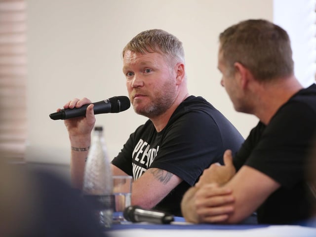 Grant McCann and Darragh MacAnthony discuss club issues during a fans' forum.