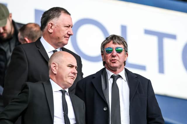 Posh co-owner Dr Jason Neale (right)  in the stands at Bolton Wanderers last weekend with interim CEO Leighton Mitchell (foreground). Photo: Joe Dent/theposh.com.