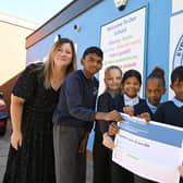 Principal Sophie Dines celebrating with pupils.