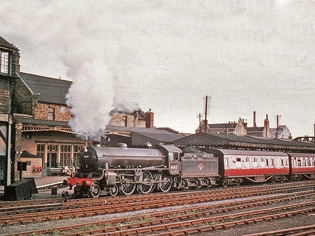 A westbound steam train awaits departure from Peterborough East station, probably very early in the 1960s.