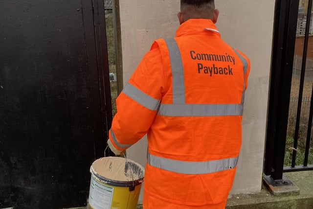 The community payback team clearing graffiti in the city centre