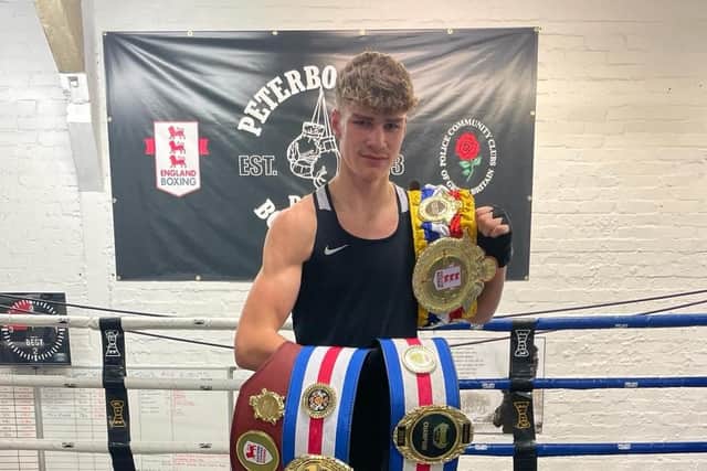 Alfie Baker with his Eastern Counties open class youth title belt, his national title belt and his MTK title belts.