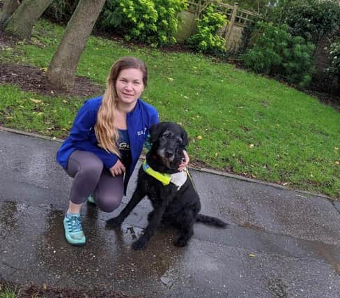 Amanda Woodford with a guide dog