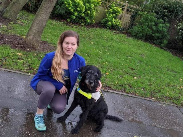 Amanda Woodford with a guide dog