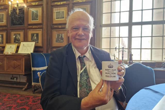Nick Sandford with mug that says 'Keep Calm During Your Election'