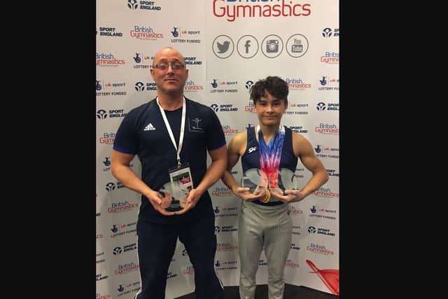 Jake and coach Ben Howells at the British Gymnastics Championships in 2017.