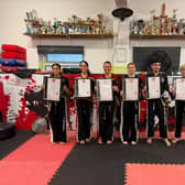The successful Hicks Family Martial Arts Club students after their black belt grading examinations, left to right, Rodaina Ali Eid, Natalie Cusumano, Raj Hassan Noor, Joanne Leonard, Liberty Schaedel and Blake Darby