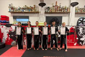 The successful Hicks Family Martial Arts Club students after their black belt grading examinations, left to right, Rodaina Ali Eid, Natalie Cusumano, Raj Hassan Noor, Joanne Leonard, Liberty Schaedel and Blake Darby
