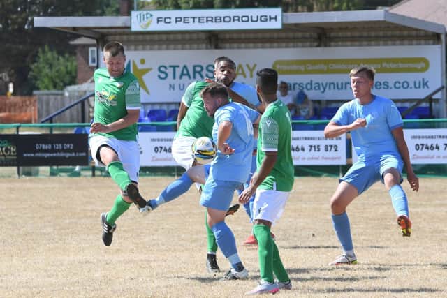 Action from a recent FC Peterborough (green) game. Photo: David Lowndes.