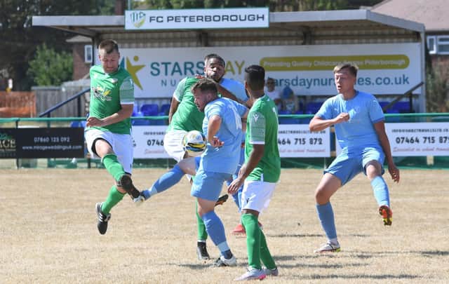 Action from a recent FC Peterborough (green) game. Photo: David Lowndes.