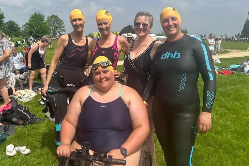 Liza Raby, right, and her team of supporters at the Burghley Open Water Swim on Saturday.