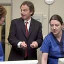 Prime Minister Tony Blair talks to Clinical Nurse Managers Louise Molina (right), and Sarah King during the official opening  of the first NHS walk-in centre at Peterborough,