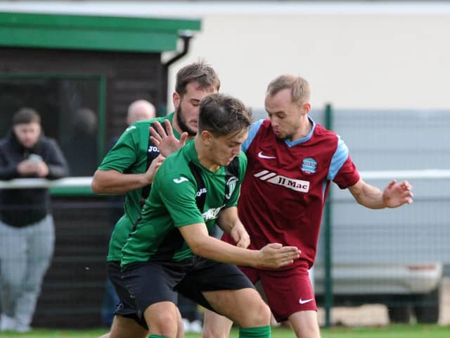 Action from Blackstones (green) v Bourne in the FA Vase