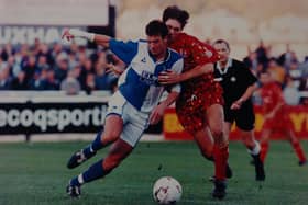 Neil Le Bihan (red) in action for Posh.
