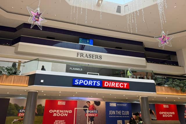 The name signs for Frasers and Sports Direct have just gone up above the doorways to the new stores in the Queensgate Shopping Centre in Peterborough