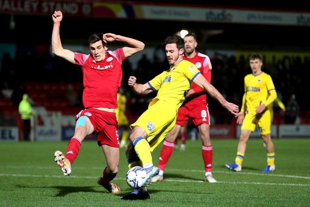 Ross Sykes (red shirt) is a 23 year-old giant centre-back at Accrington Stanley. He has played over 100 times for his only Football League club. (Photo by Charlotte Tattersall/Getty Images)