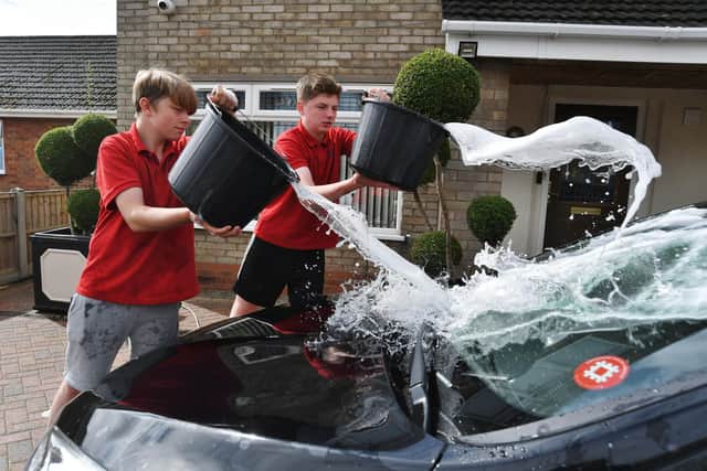 Teenage entrepreneurs Tom Dunkley and Tom Tilley are already looking to future success: "We're hoping to start an ice-scraping service in the winter."