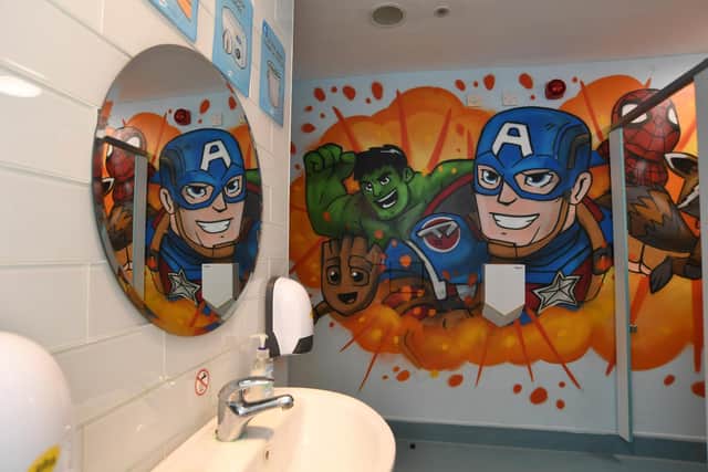 The boys toilets have been changed into a new, vibrant space, featuring The Avengers.