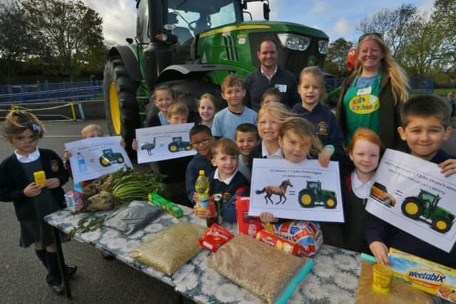 Pupils from Folksworth primary school taking part in Breakfast Week, learning about growing and cooking foods with James Burgess and Jenny Jefferies from Kids Country.