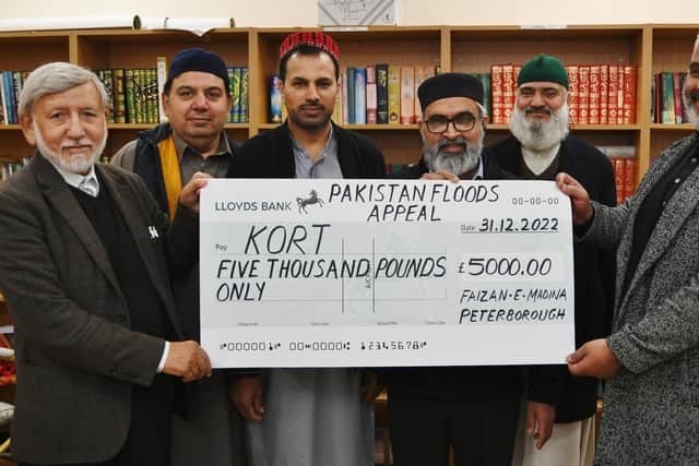 Cheque presentation from the Faizan-e-Madina Mosque to Mazar Husssain of the Kashmir Orphanage Relief Trust. Pictured are Chairman Abdul Choudhuri, Majid  Hussain, Zeeshan Ahmed, Sajjad Ahmed and Imam Alama Nawaz Hazarvi